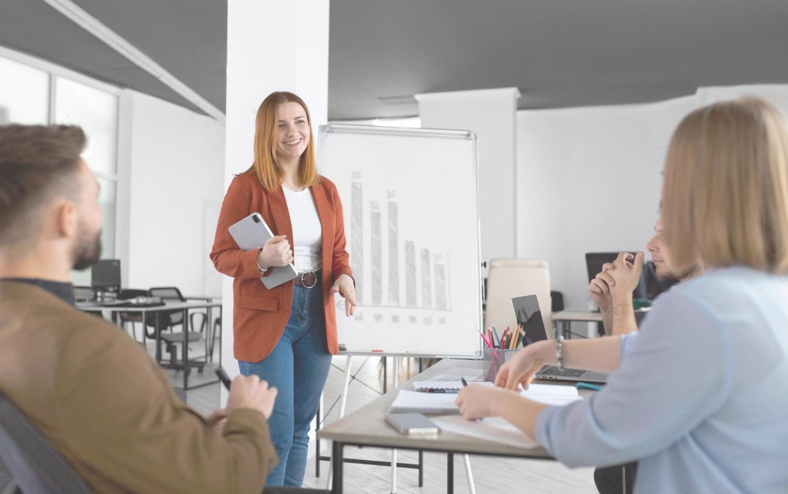 Team meeting discussing client strategies in conference room